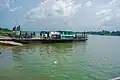 A loaded pontoon (goods, cars and people) at Oguta Lake