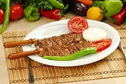 Cağ kebabı, served on a bico, or individual skewer