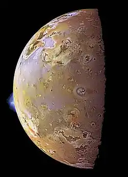 Io, with two plumes erupting from its surface.