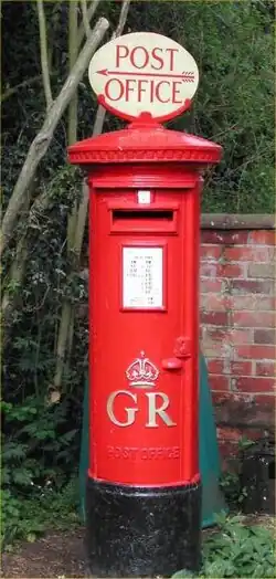 PB27/1 pillar of George V, fitted with a Post Office Direction Sign (POD) at the Colne Valley Postal History Museum, Essex