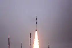 A PSLV-CA launch vehicle lifts off during daytime