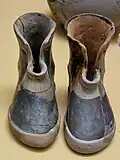 Pair of terracotta boots, offerings at a burial of a woman, circa 900 BC, Stoa of Attalos, Athens.