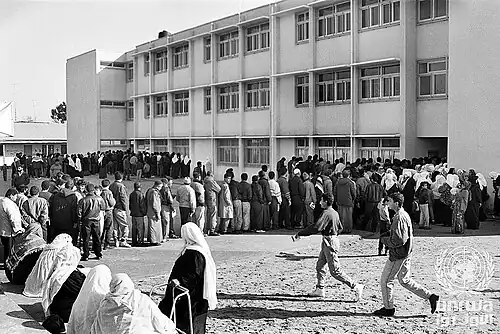 Palestinians waiting in line to cast their vote.