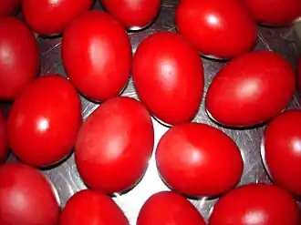 Traditional red Easter eggs for blessing by a priest