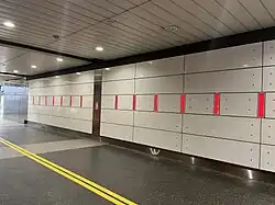 Artwork on the concourse wall as described in the following paragraph