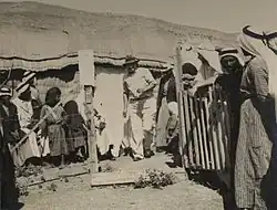 Malaria clinic, 1938 (Dr. Gideon Mer in the centre with hat)