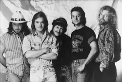 A black-and-white photo showing all five members of the country music band Pirates of the Mississippi