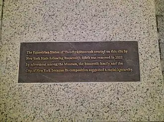 Plaque describing the reasons for the removal of the statue of Roosevelt.