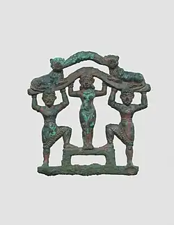 Plaque with a nude female between two bearded males wearing kilts; circa 2000–1600 BC; bronze; 9.7 x 9.7&nbsp;cm; Metropolitan Museum of Art