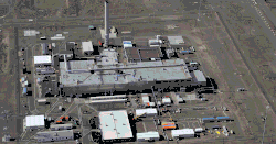 A color animation, where the first slide shows a large industrial facility, the second slide shows its underlying land after its demolition