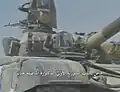 Portrait of Assad on the tank during 1990 parade.