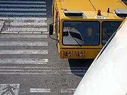 A tug ready to push back an EasyJet Airbus A319