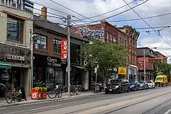 View of storefronts in Trinity-Bellwoods along Queen Street West