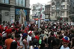 image of a crowd of people filling the street in protest