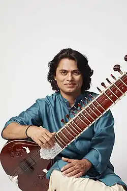 Ravi Chary playing the sitar.