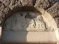 Relief above the entrance door to the tower depicting the Coat of arms of Aarhus.
