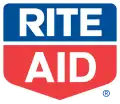 The words "Rite" and "Aid" written in white, all-capitals text, inside of a pentagon. The top half of the pentagon, containing the word "Rite", is blue, while the bottom half, containing the word "Aid", is red.