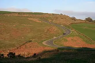road snaking up a hill