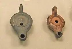 Two Roman Firmalampen. The one on the left was made in Colchester, and that on the right in Gaul. Both were found in Britain