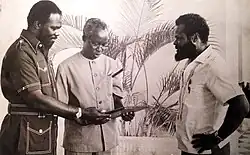 Roy Innis with CORE aide Solomon Goodrich (right), awarding Julius Nyerere (center) CORE lifetime membership