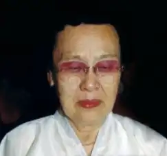 Ryo Won-gu wearing glasses and looking down