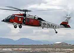 A U.S. Navy Sikorsky MH-60S Sea Hawk helicopter (BuNo 165769) attached to the "Longhorns"