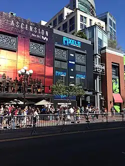 Building covered in black with blue "Pixels" text