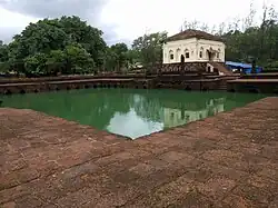 Safa Masjid adjacent to which, on the south, is a masonry tank measuring 30 by 30&nbsp;m (98 by 98&nbsp;ft), with Mihrab designs