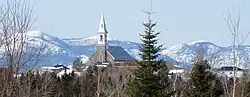 Church of Saint-Hilarion overlooking the village