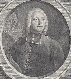 A man in clerical garb and a wig, gazing at the upper distance.