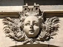 A mascaron depicting Cybele on the riverside façade