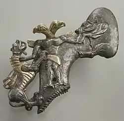 Axe with eagle-headed demon & animals; late 3rd millennium-early 2nd millennium BC; gilt silver; length: 15&nbsp;cm; Metropolitan Museum of Art (New York City)