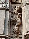 Salabhanjika style statues adoring the outside wall of the temple.