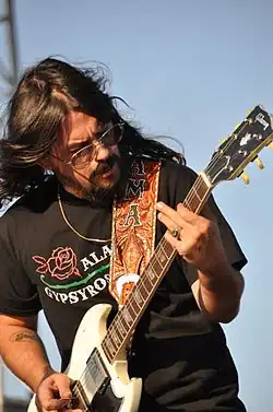 Shooter Jennings playing an electric guitar