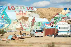 View of Salvation Mountain with "LOVE IS UNIVERSAL" text painted on colorful hillside