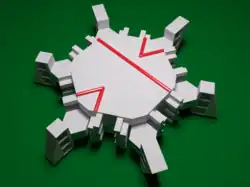A three-dimensional analogue of the monotile, with matching rules implemented geometrically. Red lines are included only to illuminate the structure of the tiling. Note that this shape remains a connected set.