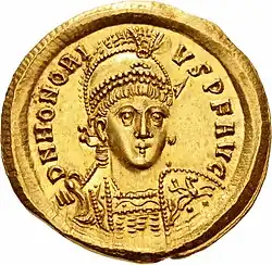a gold coin bearing the stylised full face of the Emperor Honorius