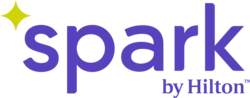 A lime green four-pointed round star nested above and to the left of the word "spark" in a purple sans serif. The endorsement "by Hilton" appears in the lower right.