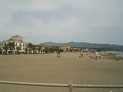 View of the beach of Marina di Casalvelino with the hills of Ascea in background