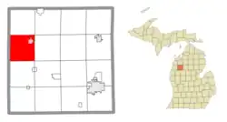 Location within Wexford County (red) and an administered portion of the Mesick village (pink)