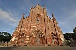 Colour photograph of the exterior of St Magnus Cathedral, Kirkwall, showing the main entrance