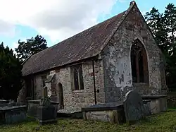 A small, simple stone church seen from the southeast