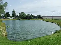 Pozytywka Pond in the Jeziorki Ditch drainage basin, reclaimed to increase retention capacity, potentially part of the ditch's course