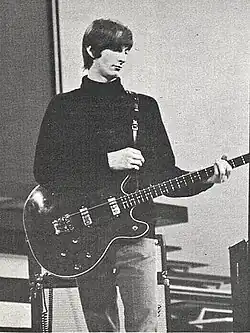 Boone playing bass onstage c. 1965