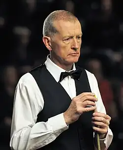 Steve Davis chalking his cue stick.