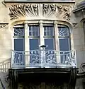Wrought iron balcony and detail of façade