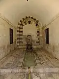 Inside the iwan, with wall fountain at the back and water channel in the middle