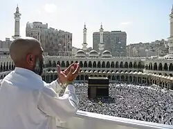 Raising hands in Dua.