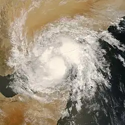 The image shows Deep Depression ARB 02 near peak intensity over the Gulf of Aden. Yemen and Oman are visible at the top, while Somalia is visible at the bottom. Two main blobs of clouds are visible.