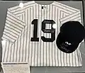 Masahiro Tanaka autographed New York Yankees jersey and cap held by the Japanese Baseball Hall of Fame.